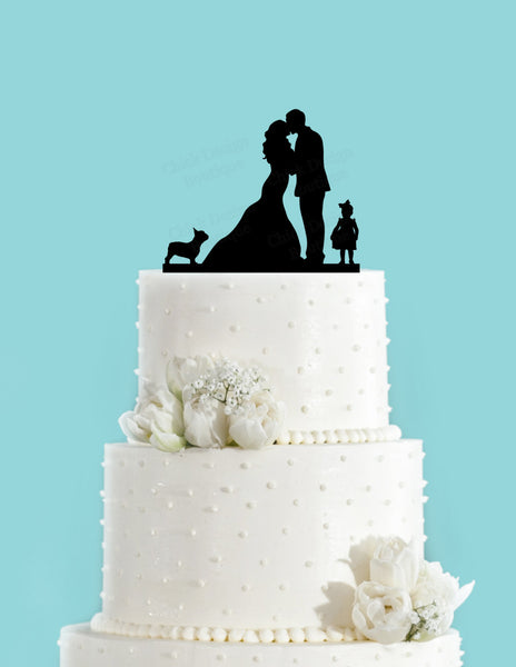 Couple Kissing with French Bulldog and Little Girl Standing with Bride and Groom Wedding Cake Topper